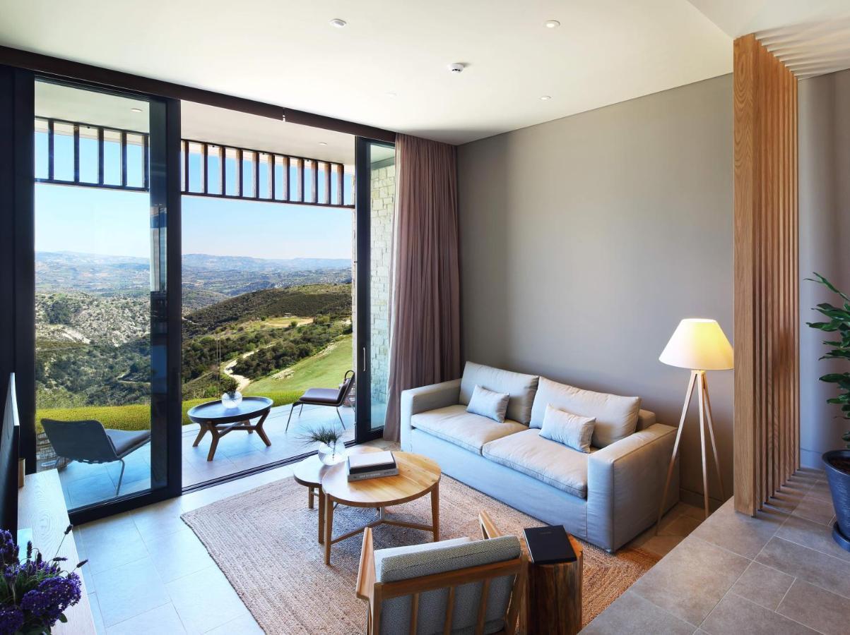 Minthis Resort Tsadha المظهر الخارجي الصورة A living room at the hotel